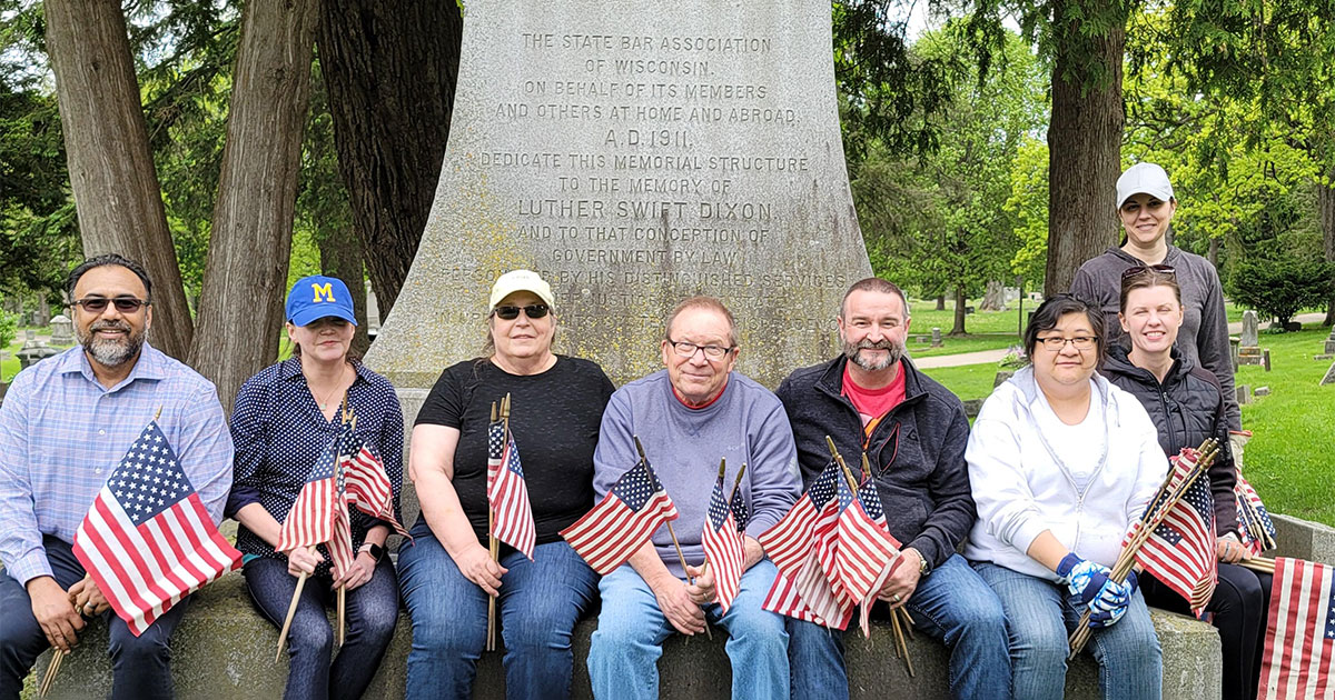 State Bar staff place U.S. flags at veterans’ graves