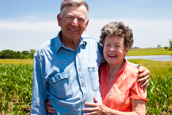 Elderly husband and wife farmers