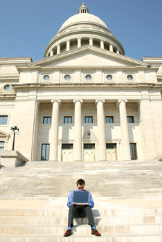 Working on laptop on capitol steps