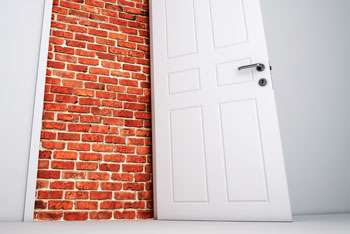 Door to a brick wall