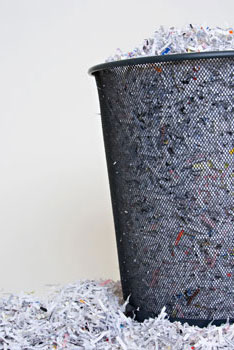 shredded paper in trash can
