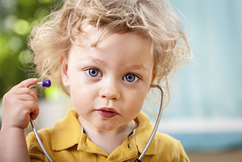 toddler with stethescope