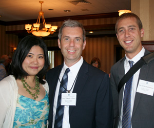 Timothy J. Dorr (center) is joined by his wife and Brian   Huttenburg.
