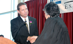 Newly sworn-in State Bar President   James Boll is congratulated by Chief Justice Shirley S. Abrahamson.
