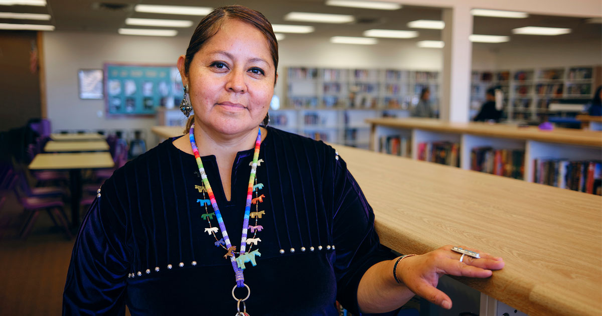 Navajo librarian looks at the camera