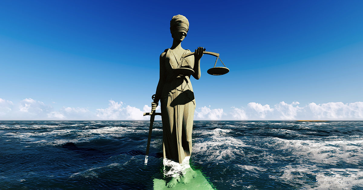 statue of justice in water