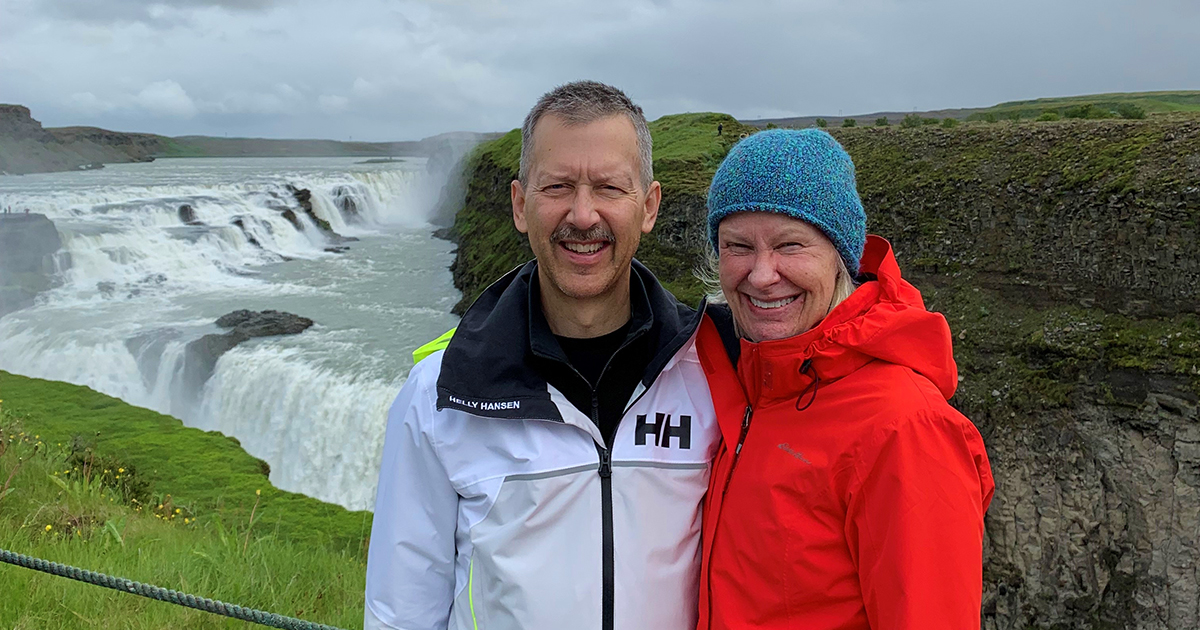 Judge James Babler and his wife Susan stand in front of a waterfall in Iceland