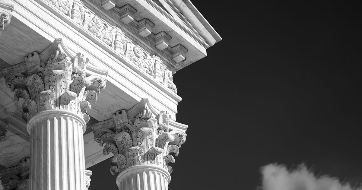 Supreme Court building columns against the sky