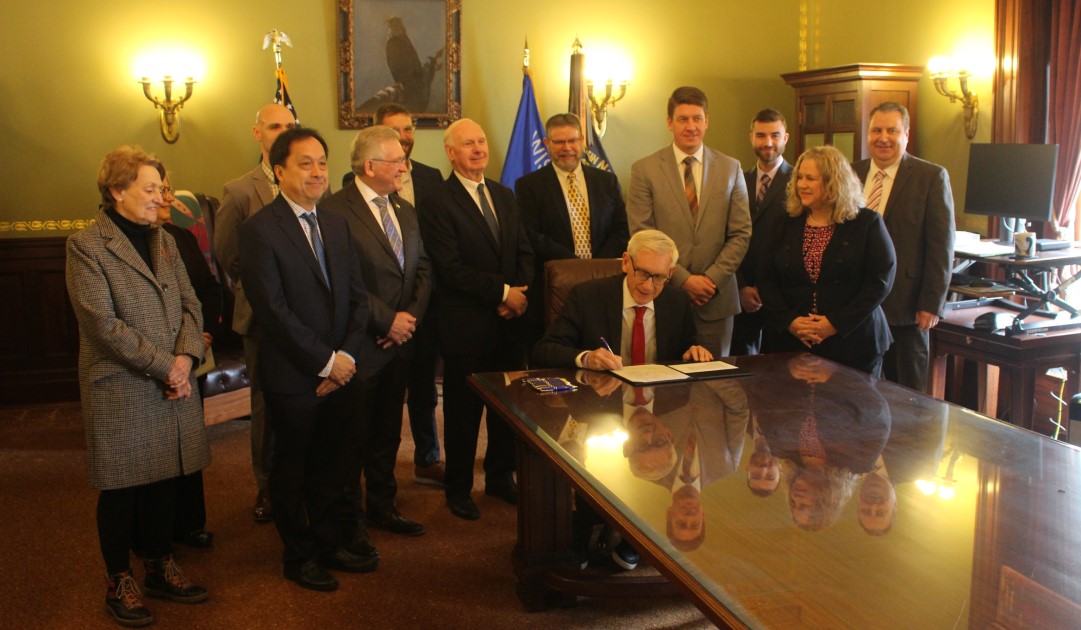 Gov. Evers signing a bill