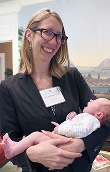 Catherine White has two reasons to be proud - as a new Wisconsin lawyer and as the mother of 3-week-old, yawning Bette Fagan.