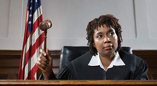 Female African American judge with gavel
