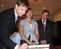 Kyle Hanson signs the Supreme Court Roll