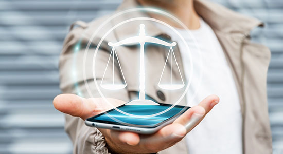 lawyer holding smartphone accessing legal resources