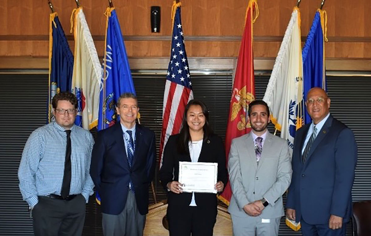 Secretary of the Wisconsin Department of Corrections, Kevin A. Carr, right, and members of the DOC’s legal team pose with DCP clerk Jodi Chung
