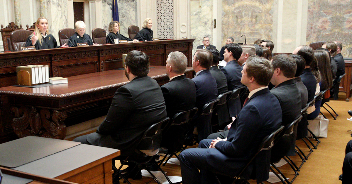 Lawyers in the Supreme Court Hearing Room listen to Chief Justice Annette Kingsland Ziegler
