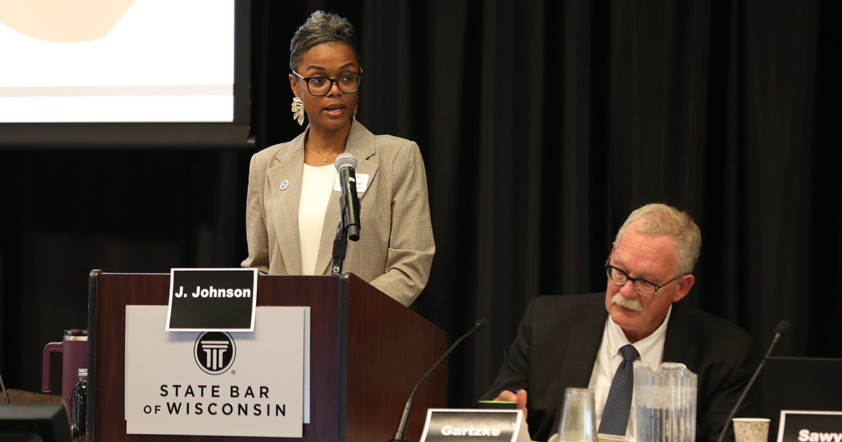 a woman standing behind a podium