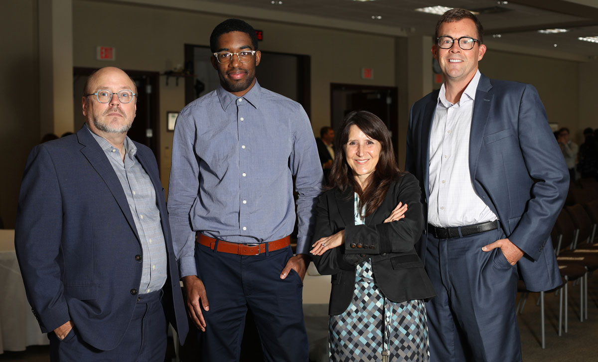 Nathaniel Douglas poses with attorneys with the Office of Lawyer Regulation