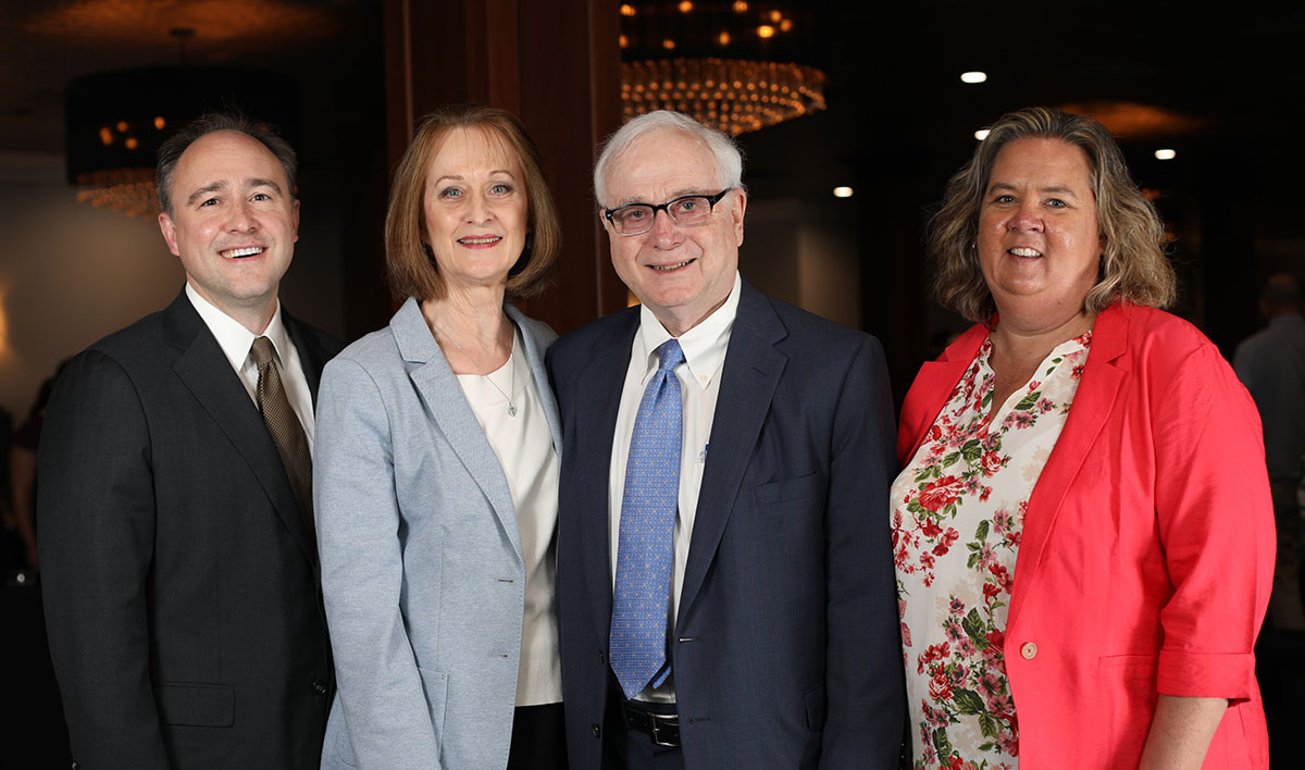 Foley & Lardner LLP celebrates 50-year member Wayne Lueders (second from right)