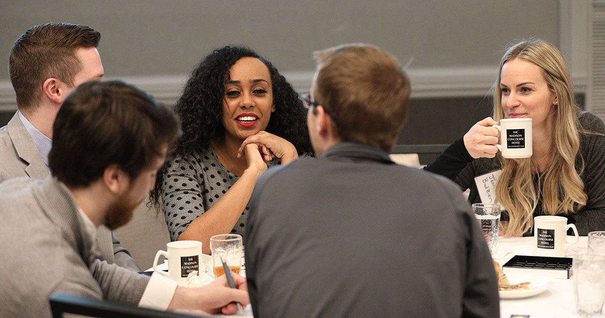 young lawyers conference table conversation