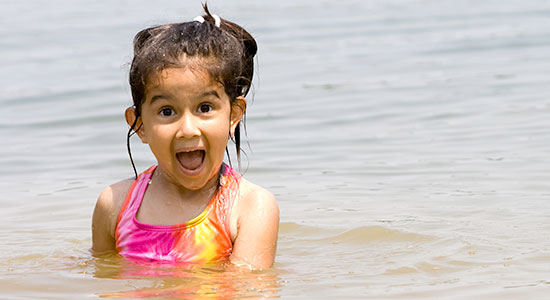 girl swimming in a lake