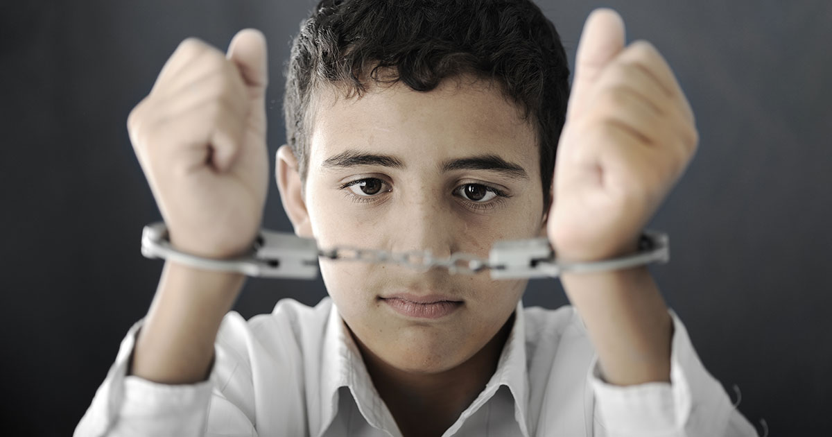 child in handcuffs