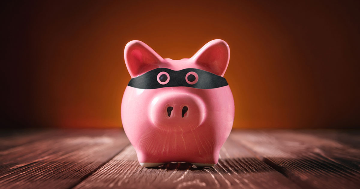 piggy bank with thief mask
