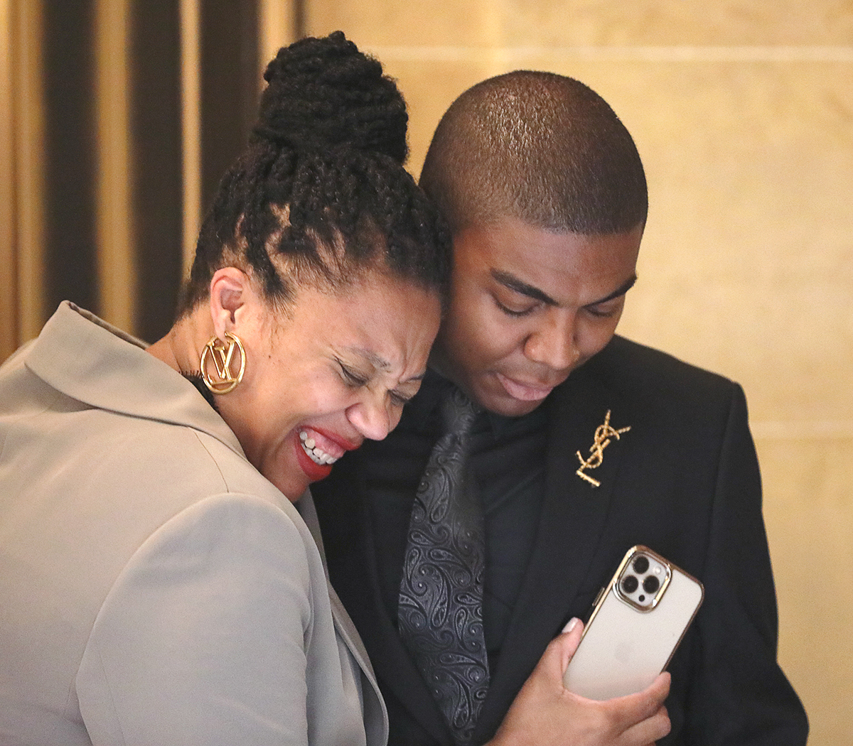 Keronten Ewings (right) with his mother, Takisha Ewings, share a hug