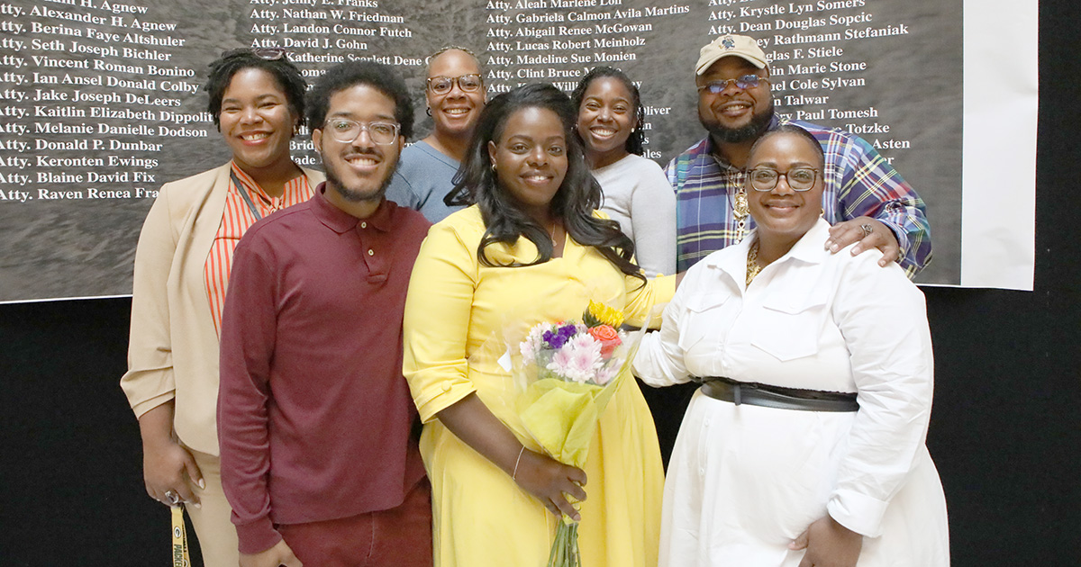 Alexis Nash (center) poses with her family