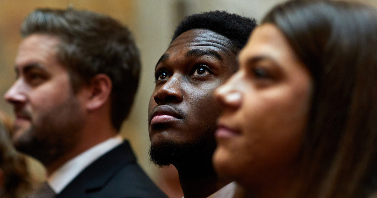 three people attending the ceremony