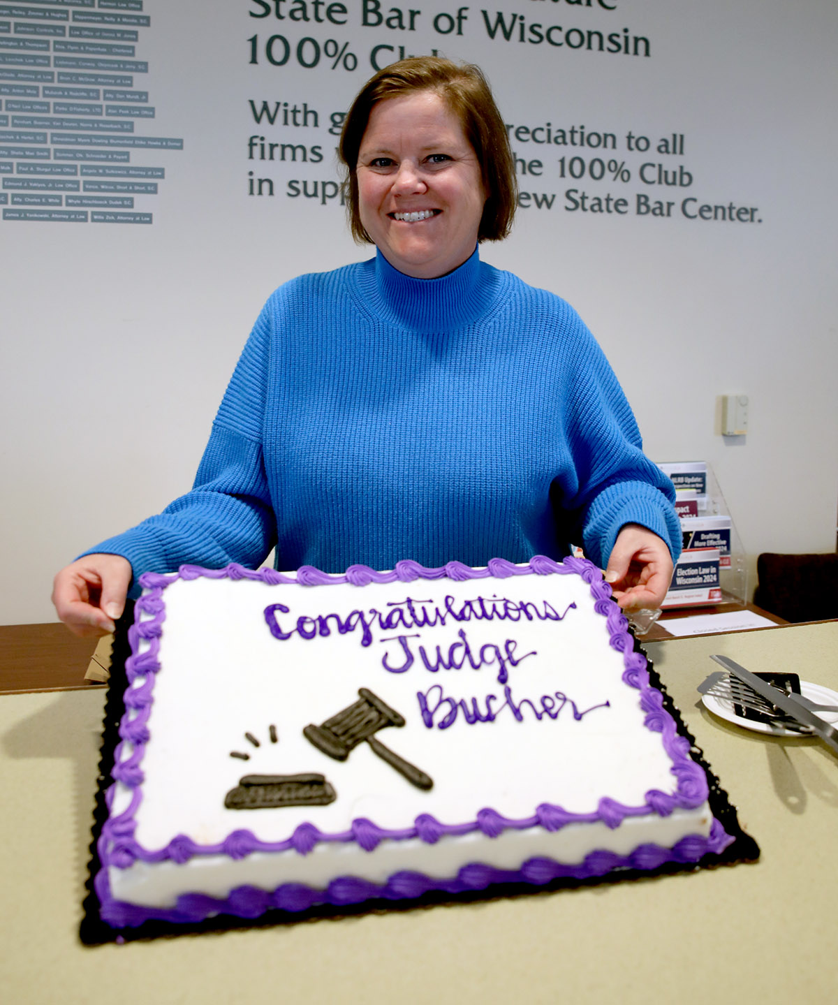 Jane Bucher poses with her cake