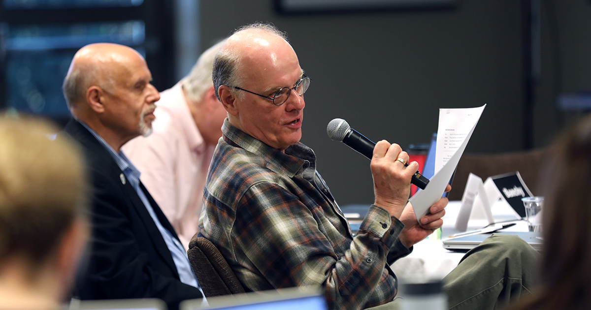 Lawrence Wiesneske speaks into a microphone