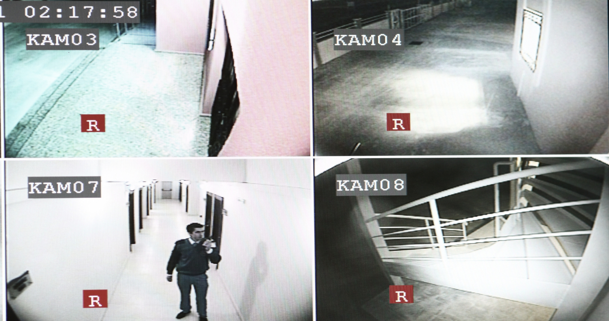 Four-Way Black And White Images Recorded By Surveillance Cameras, Displayed On A Screen
