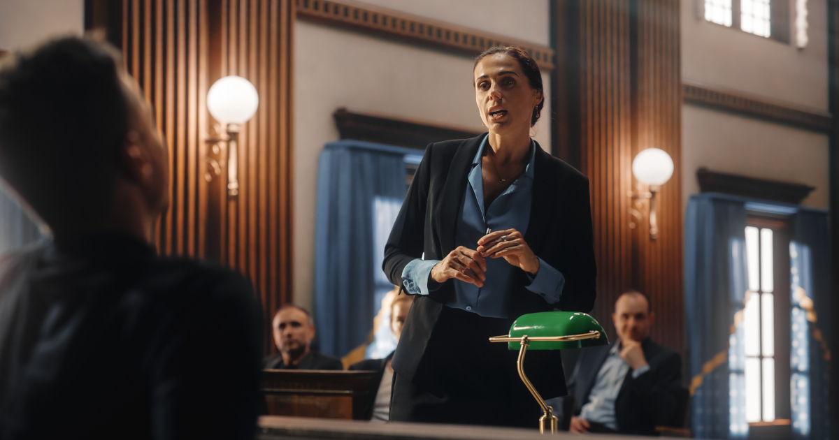 A Woman Lawyer Questioning A Witness On The Stand