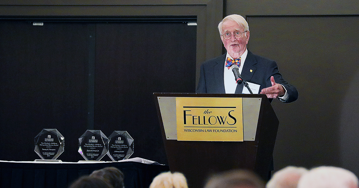 Former Wisconsin Governor Tony Earl at a podium in front of an audience