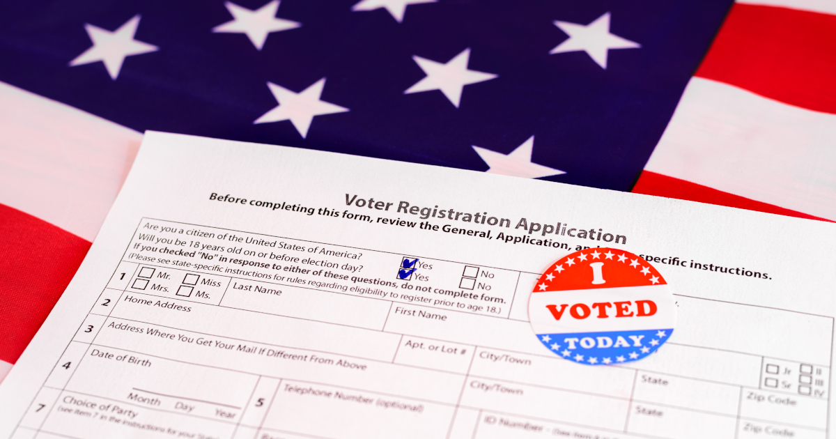 A Voter Registration Form Lying Atop A Large American Flag