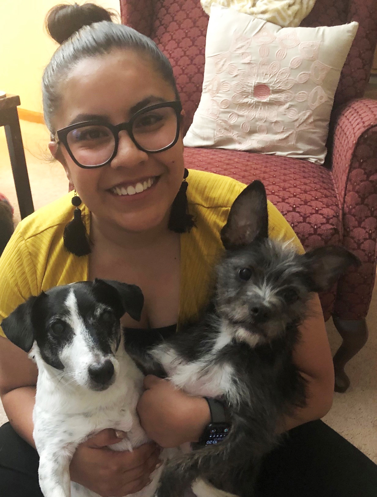 Marisol Gonzalez Castillo poses with her two dogs