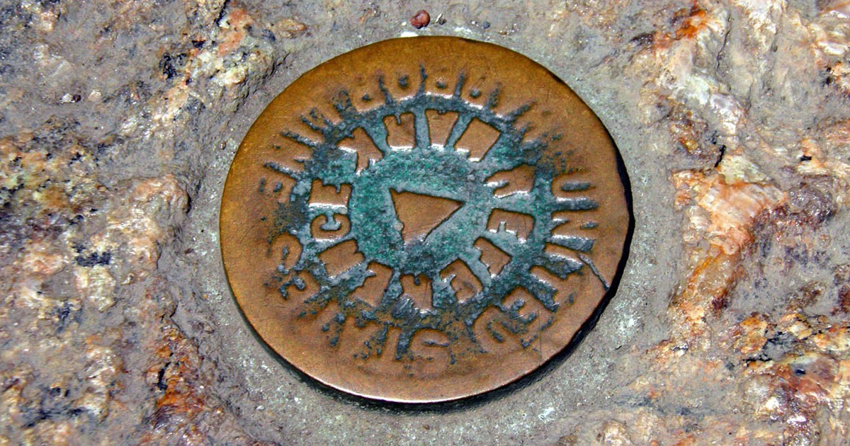 a metal disk on the base of the Statue of Liberty