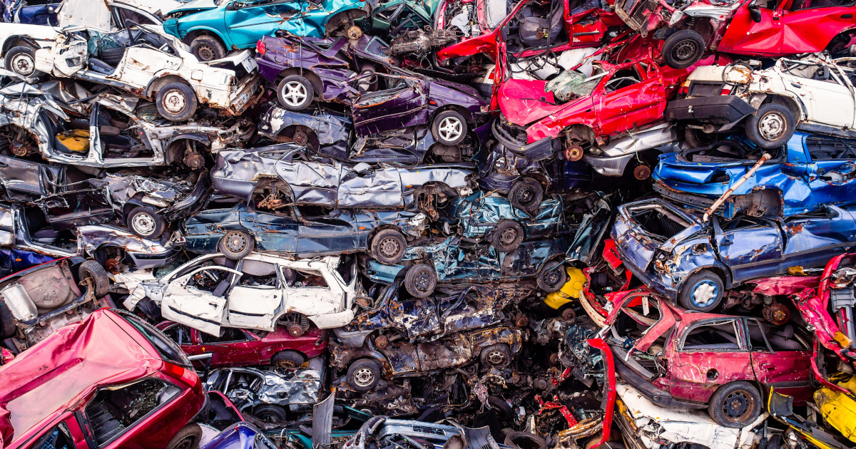 A Vast, Multicoloured Jumble Of Junked Automobiles Piled Atop One Another