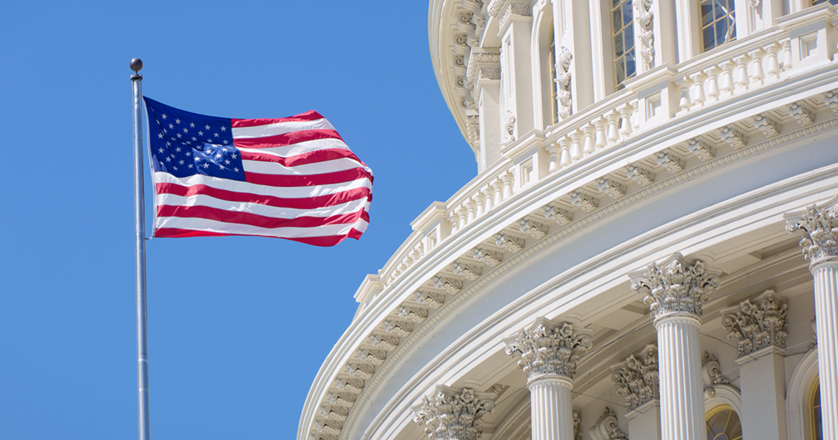 stock photo of U.S. Capitol building and flag