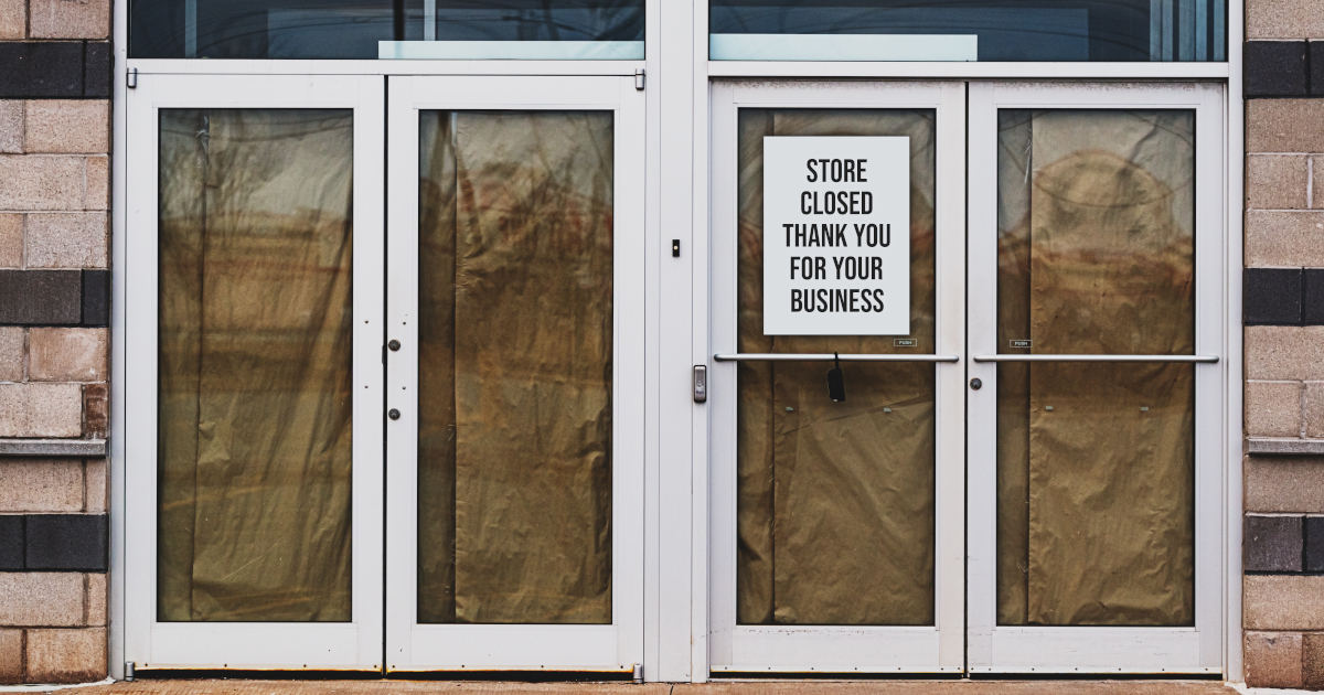 Drop Cloths Behind Shopping Mall Doors And A Sign That Reads Store Closed Thank You For Your Business