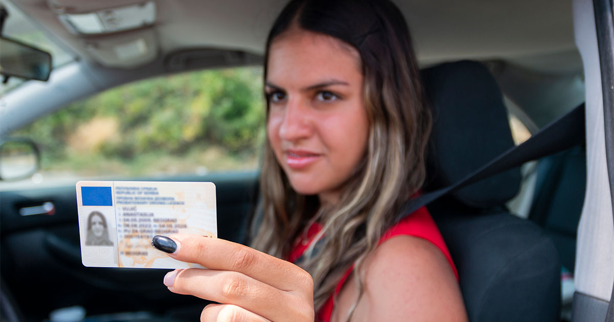 woman handing id card