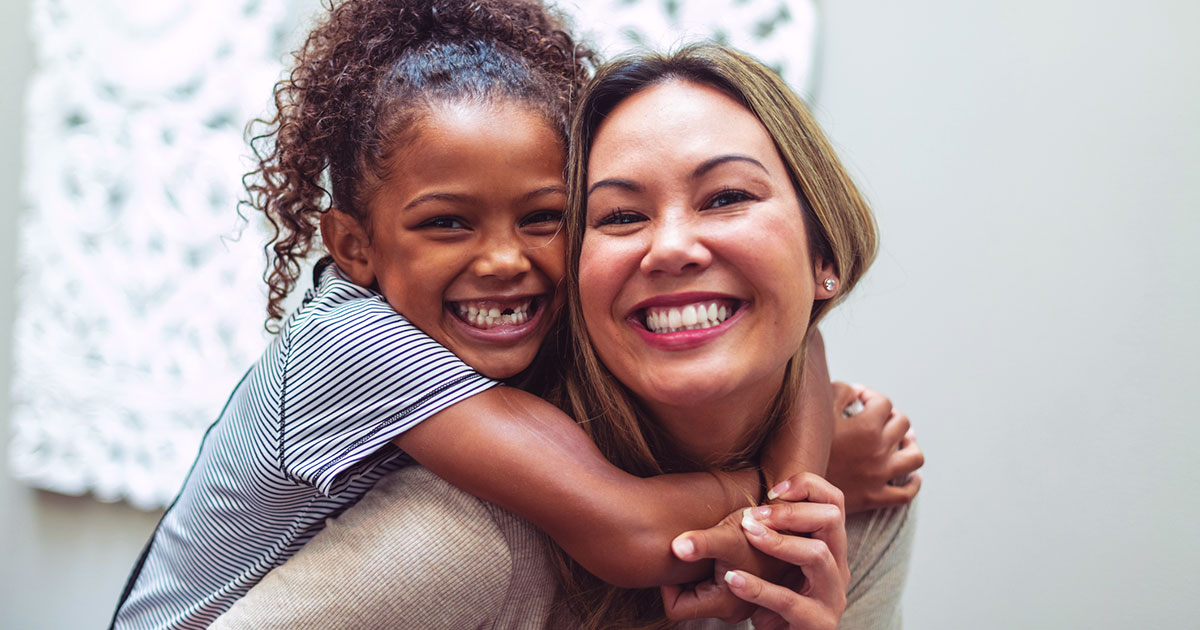 smiling mother and daughter