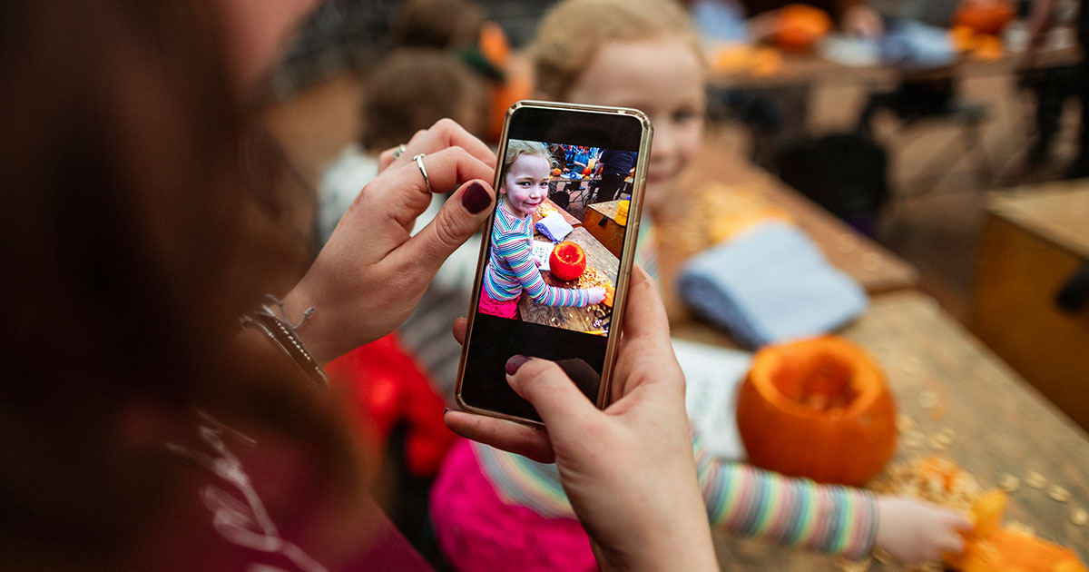 parent photographing child