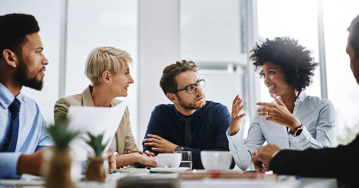 professionals discussing around a table