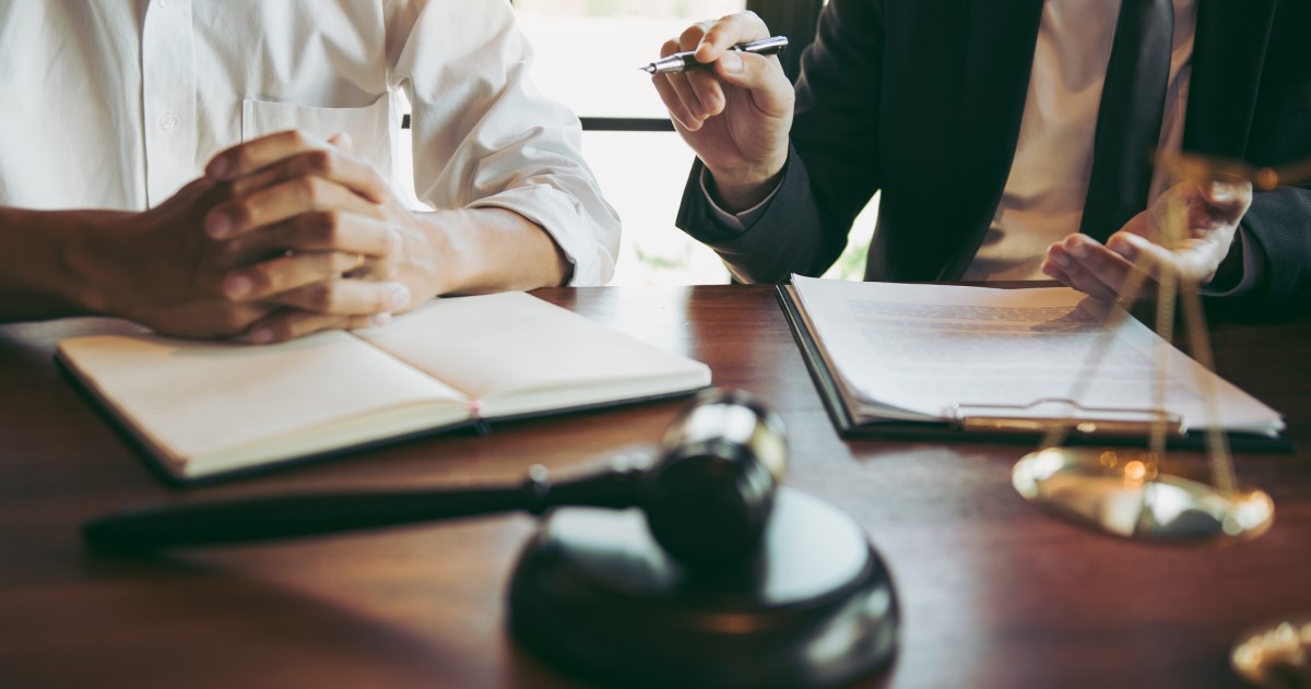 Images of hands of attorneys helping clients