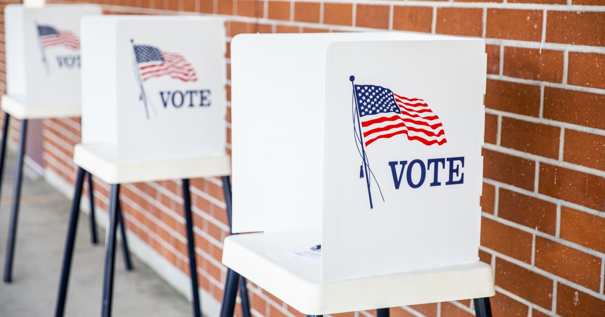 Voting booths with the word "vote" printed on them