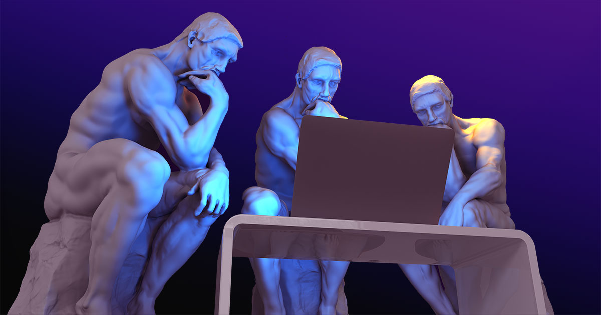 thinking statues surrounding laptop