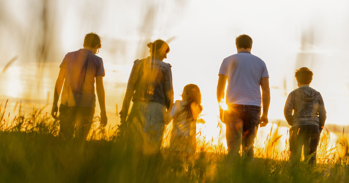 family walking in field