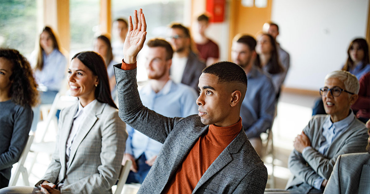 attorney raising hand at even