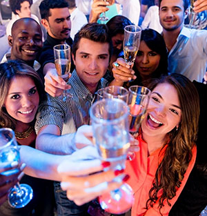 people raising drinks in a toast